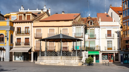 Facades of quaint old houses around the main square of Aranda de Duero, Spain.