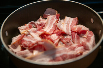 Cooking bacon on a stove top