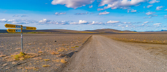 Dirt road near Herdubreid and Askja volcanoes in the lifeless volcanic desert in Highlands, with...
