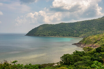 Fototapeta na wymiar Mr Cau beach or Bai Ong Cau and mangroves on Con Dao island, Ba Ria Vung Tau, Vietnam. View from road around the island 