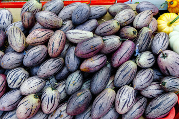 Horizontal background of fresh striped eggplants