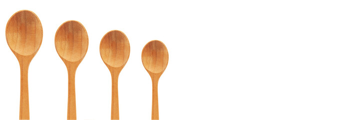 carved wooden spoons on a white background. the concept of manufacturing historical objects	