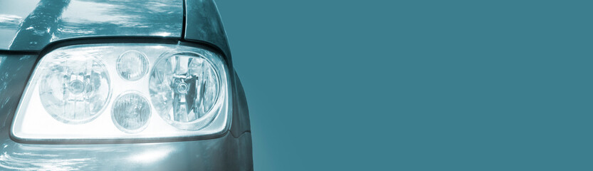 front headlight on a  turquoise car. concept of selling auto parts	