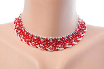 Women's necklaces made of multi-colored beads with Ukrainian national patterns.