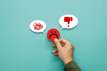 Service rating, satisfaction and negative feedback concept. Customer show bad face emoticon on a...