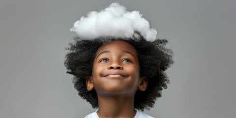 African American elementary school boy child kid with his head in clouds on studio blue background. Unable to focus, dreaming about something, sleeping, problems with being attentive during education