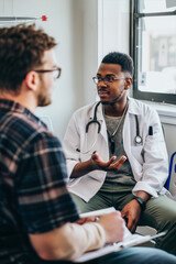 Young doctor in a white coat attends to a patient