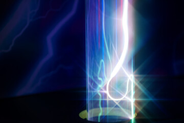 A glass tube with red and blue light from the gas. - Powered by Adobe