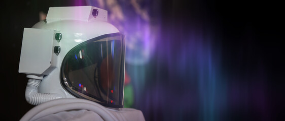 A white astronaut helmet with a purple background