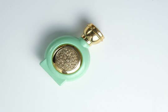 Isolated non alcohol perfume in beautiful bottle. Botol parfum