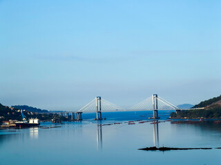 View of the Rande bridge from the bottom of the Vigo estuary with the sea completely calm. Spain.