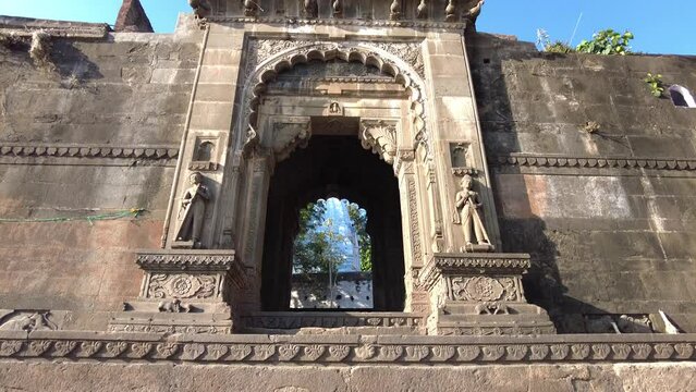 Maheshwar, Madhya Pradesh, INDIA - February 24, 2024, Exterior View of the scenic tourist landmark Maheshwar fort (Ahilya Fort) and temple. This monument is on the banks of the Narmada River.