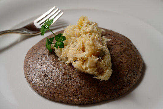 Baccala alla Vicentina with Black Polenta Nera Close Up of Vicenza Style Stockfish