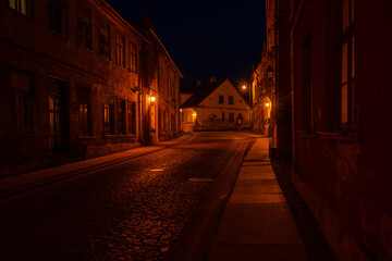 Latvia. Kuldiga. Old town street in the night.