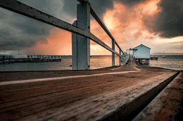 The low-angle view of a pier in Millionaire's Walk in Mornington Peninsula at dawn