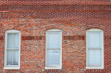 Old Brick Building with White Window Frames and Blinds in Downtown Indianapolis, IN, USA