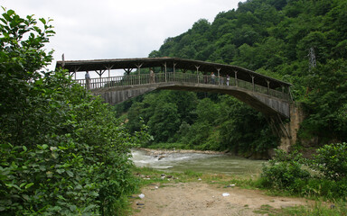Fototapeta na wymiar Located in Trabzon, Turkey, the Hapsiyas Bridge was built in 1935. It is made of tiles and wood.