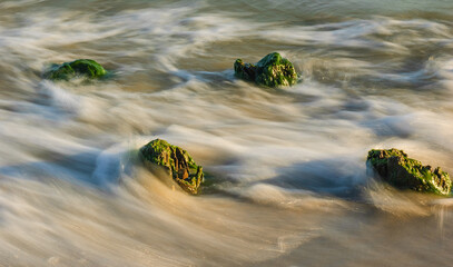 Seascape. Breakwater in the sun. Leba. Baltic Sea. Poland. - obrazy, fototapety, plakaty