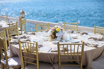 White color wedding table decorated with decorative and elegant for wedding. There are flowers,...