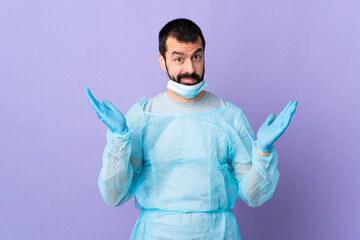 Surgeon man with beard with blue uniform over isolated purple background making doubts gesture
