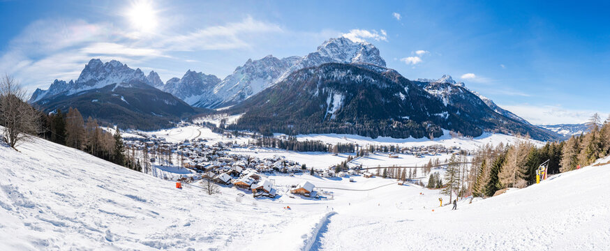 Wide panoramic view of winter landscape with snow covered Dolomites in Kronplatz, Italy