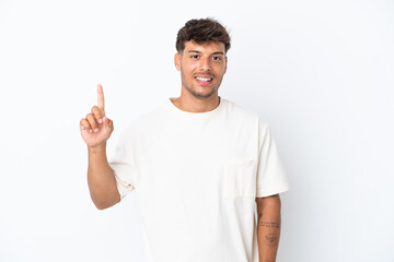 Young caucasian handsome man isolated on white background showing and lifting a finger in sign of...