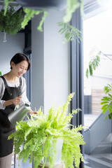 Image of a woman working in horticulture, gardening or florist Vertical