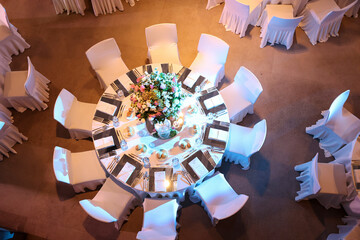 White color wedding table decorated with decorative and elegant for wedding. There are flowers,...