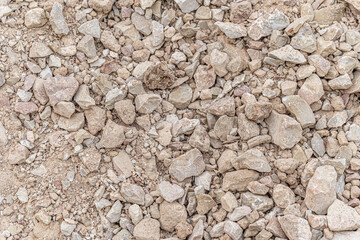abstract background of gravel pebbles on the road close up