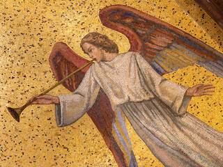MILAN, ITALY - MARCH 4, 2024: The detial of mosaic of angel with the trumpet in the church Chiesa di San Agostino designed by Elena Mazzari from 20. cent.	
