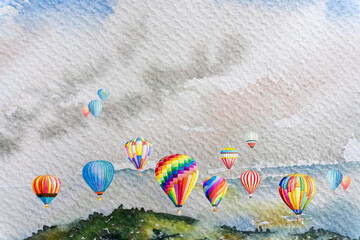 Watercolor painting colorful hot air balloons flying over mountain.