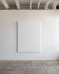 Blank canvas on a white gallery wall.