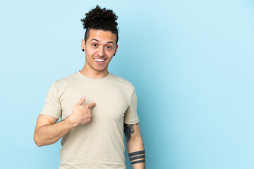 Caucasian man over isolated background with surprise facial expression