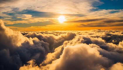 Most magnificent cloudscape stormy sky in shades of fiery yellow and orange. Areal view inside the...