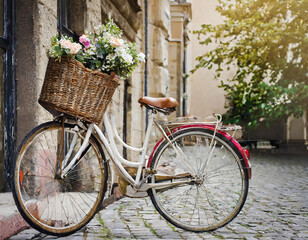 Retro style bicykle with basket in the street