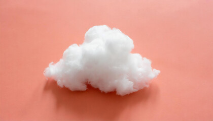 White cloud against pastel coral color background. Weather minimal concept.