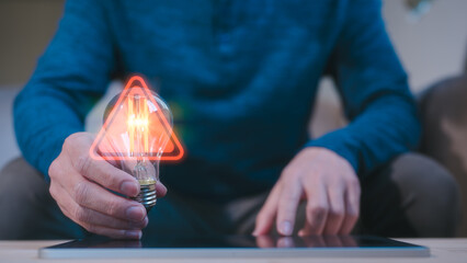 man hand holding illuminated light bulb of new ideas with innovative technology and creativity and...