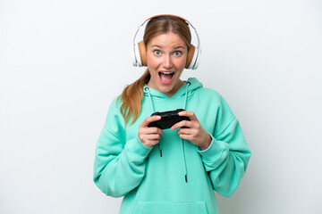 Young caucasian woman playing with a video game controller isolated on white background with...