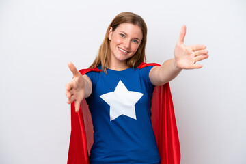 Young caucasian woman isolated on white background in superhero costume and doing coming gesture