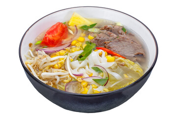 Thai style noodle soup with beef and vegetables isolated on white background