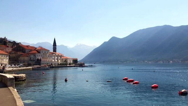 View of the historic town of Perast on the coast of the Bay of Kotor on a beautiful sunny morning. Adriatic Sea. Historic city of Perast, Montenegro. Europe.