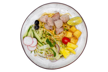 Noodles with tuna and vegetables on a white background. Isolated