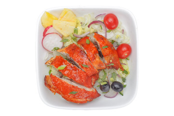 Chicken kebab in tomato sauce with vegetables on a white background
