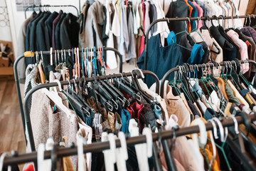 Close-up of Rows of Clothes on Hangers