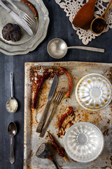 Various old kitchen objects on black chalkboard background