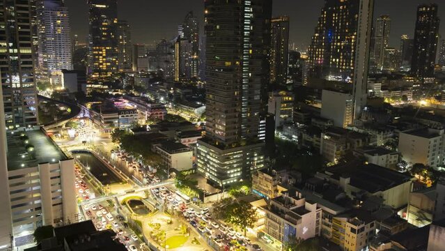 Night time lapse of Bangkok city with traffic on road top view