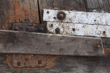 A close-up of weathered wood and corroded metal
