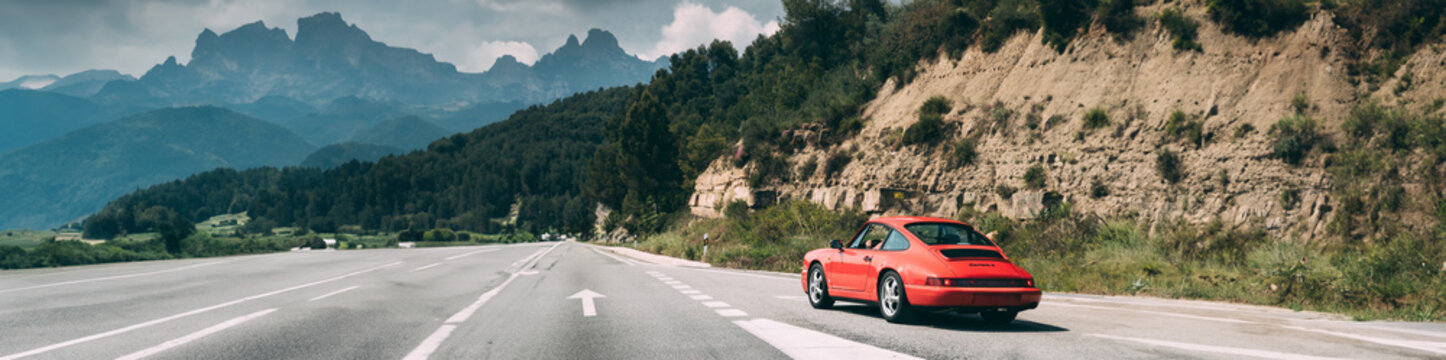 Castellbell I El Vilar, Spain - May 18, 2018: Porsche 911 Carrera 2 Coupe On Motorway Highway Freeway Road. Porsche 964 is company's internal name for Porsche 911 manufactured and sold in 1989-1994