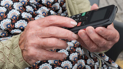 Elderly person using a mobile phone