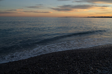 Sunset on the French Riviera pebble beach in Nice - 778173137